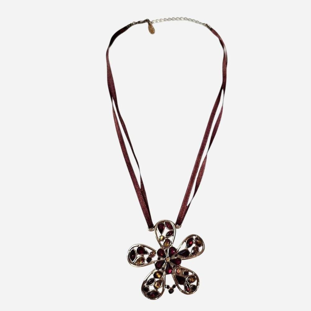 Brown ribbon necklace with a large floral pendant